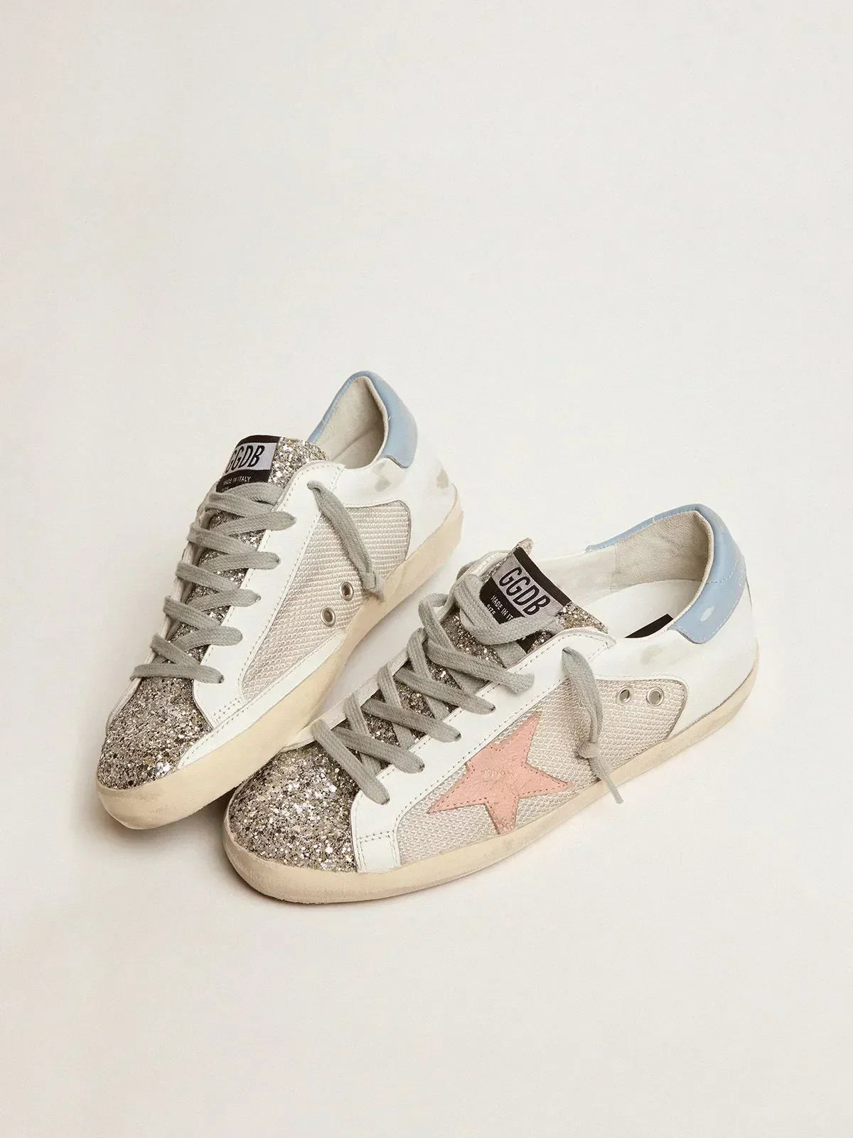 Super-Star LTD sneakers in white leather with mesh insert and silver glitter tongue